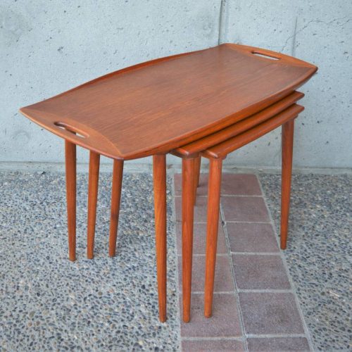 Sultry Danish Modern set of 3 flared TEAK NESTING TABLES by Quistgaard